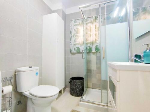 a bathroom with a toilet and a shower and a sink at Studio with wonderful ocean view and free WiFi, in Icod de los Vinos in Icod de los Vinos