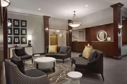 a lobby with couches and chairs and a table at Homewood Suites by Hilton Philadelphia-City Avenue in Philadelphia