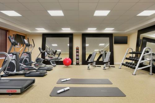 a gym with treadmills and ellipticals and exercise equipment at Hilton Garden Inn Statesville in Statesville