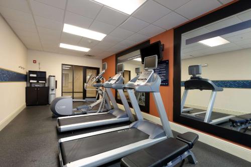 a gym with tread machines and a mirror at Hampton Inn & Suites Baton Rouge - I-10 East in Baton Rouge