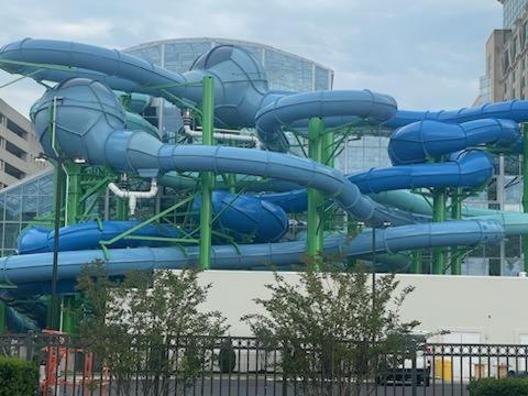 a blue water slide in front of a building at Cozy Colorful Luxury Family Home, House or Romantic Atlantic City Getaway, Fast Wifi, Free Parking, Work station, Alexa enabled, Fenced in Backyard, Patio, Porch, Blocks from Casino, Beach and Boardwalk and Live Entertainment and Restaurants in Atlantic City