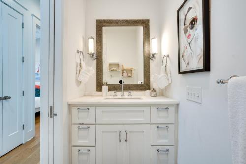 a bathroom with a sink and a mirror at Lovely Mt Pleasant Townhouse with Central Location! in Charleston