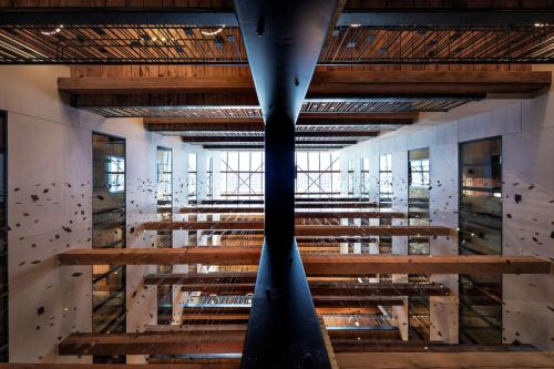 a large room with wooden stairs in a building at Canopy by Hilton Minneapolis Mill District in Minneapolis