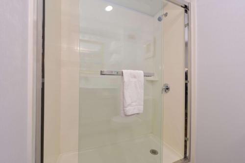 a bathroom with a shower with a glass door at Hampton Inn Tulsa Sand Springs in Tulsa