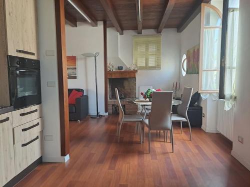 a kitchen and dining room with a table and chairs at La Casetta Di Alfonso in Santa Marinella