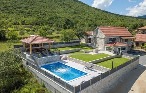 an estate with a swimming pool and a house at Villa Ivandvor in Sinj