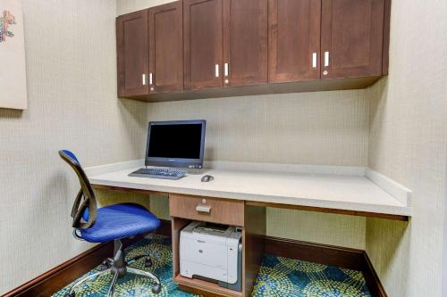 an office with a desk with a laptop and a chair at Hampton Inn & Suites Manchester, TN in Manchester