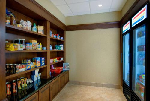 a convenience store aisle with shelves of food at Homewood Suites by Hilton Sacramento Airport-Natomas in Sacramento
