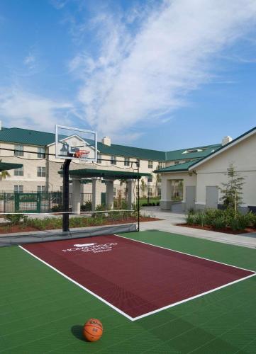 a basketball court in front of a building with a basketball hoop at Homewood Suites by Hilton Sacramento Airport-Natomas in Sacramento