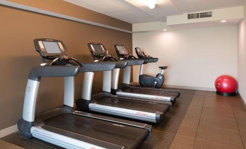 a row of treadmills in a gym at DoubleTree Hotel & Suites Charleston Airport in Charleston