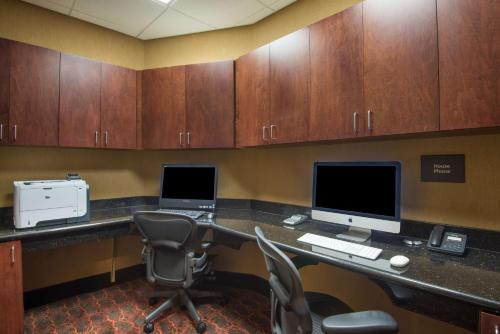 an office with a desk with two computers on it at Hampton Inn Kingston in Kingston