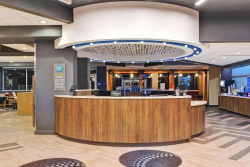 a lobby of a dental office with a reception counter at Tru By Hilton Richmond in Richmond