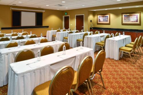 a conference room with white tables and chairs at Hampton Inn & Suites Tacoma in Tacoma
