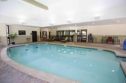 a large swimming pool in a hotel at Hampton Inn & Suites McAlester in McAlester