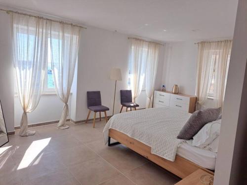 Ένα ή περισσότερα κρεβάτια σε δωμάτιο στο Ribarska Guest House Komiža