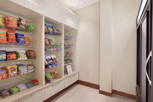 a walk in pantry with lots of food at Hilton Garden Inn Rochester Downtown, NY in Rochester