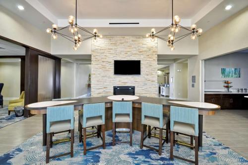 a dining room with a table and chairs at Homewood Suites by Hilton New Braunfels in New Braunfels