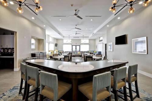 a large dining room with a large table and chairs at Homewood Suites by Hilton New Braunfels in New Braunfels