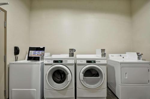 a laundry room with two washer and dryers at Homewood Suites by Hilton New Braunfels in New Braunfels