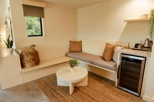 a small living room with a couch and a table at Brut Hotel in Tulsa