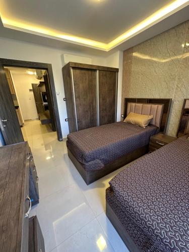 a hotel room with two beds in a room at modern 2bedroom for rent Abdoun in Amman