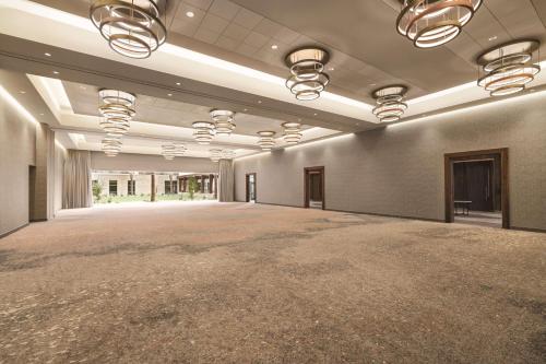 an empty ballroom with a large room with a large floor at Hilton North Scottsdale At Cavasson in Scottsdale