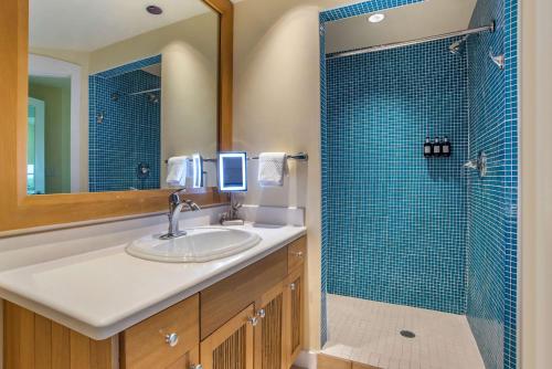 a bathroom with a sink and a shower at Hilton Grand Vacations Club Sandestin in Destin