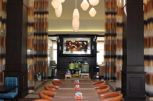 a conference room with a long table and chairs at Hilton Garden Inn Clovis in Clovis