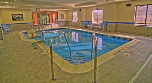 a pool in a hotel room with a swimming pool at Hampton Inn and Suites Parsippany/North in Parsippany