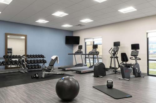 a gym with several exercise bikes and a ball on the floor at Hampton Inn O'Fallon, Il in O'Fallon