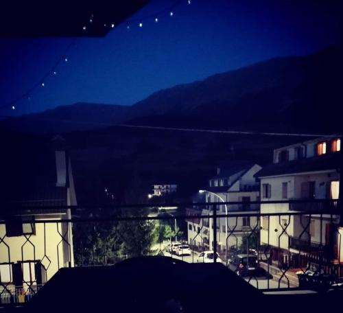 a view of a city at night with buildings at Nicola's house in Campo di Giove