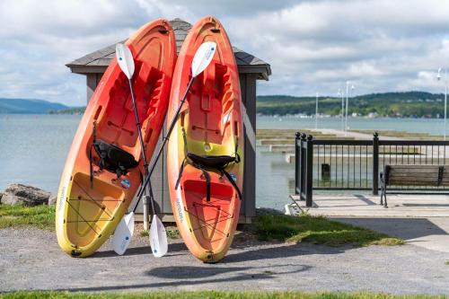 two kayaks are on display next to the water at Hotel Canandaigua, Tapestry Collection By Hilton in Canandaigua