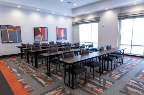 a classroom with tables and chairs in a room with windows at Hampton Inn Black Mountain in Black Mountain