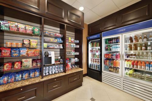 a grocery store aisle with drinks and food at Hilton Garden Inn Warner Robins in Warner Robins