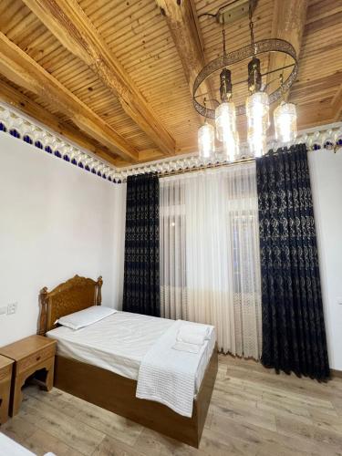 Ένα ή περισσότερα κρεβάτια σε δωμάτιο στο Khalid Boutique