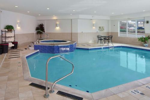 a large swimming pool in a hotel room at DoubleTree by Hilton Jefferson City in Jefferson City
