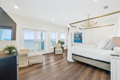 a bedroom with a bed and a living room at St Joe Beach House - Sailfish by Panhandle Getaways in Saint Joe Beach