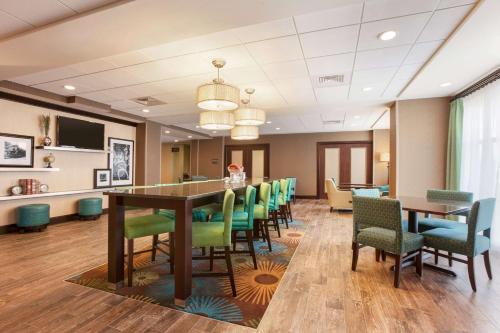 a conference room with a long table and chairs at Hampton Inn Belton/Kansas City in Belton