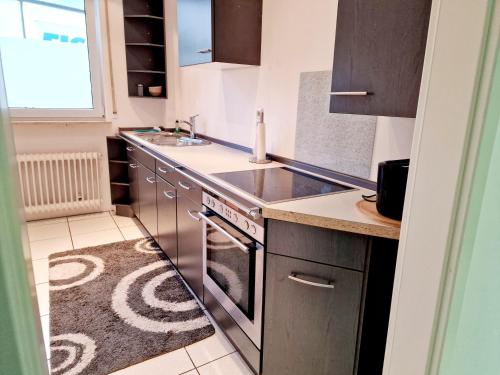 Dapur atau dapur kecil di Gruppenfreundliches Apartment
