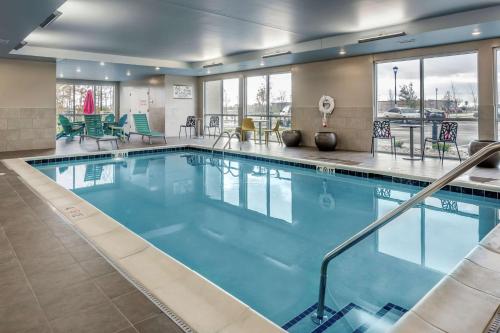 a large pool with blue water in a hotel room at Home2 Suites By Hilton Dayton Centerville in Centerville