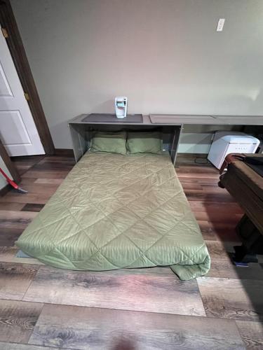 a bed sitting on the floor in a room at Game Junction in Montgomery