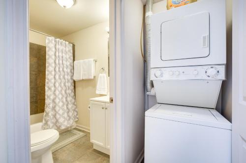 a small bathroom with a washer and dryer at Central Chicago Loft Walk to Soldier Field! in Chicago