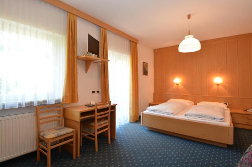 Postel nebo postele na pokoji v ubytování Garni-Hotel Pichler