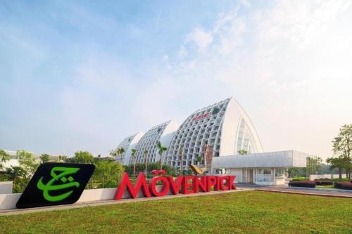 a movember sign in front of a large building at Alanis Suite With Netflix @ KLIA Sepang in Sepang