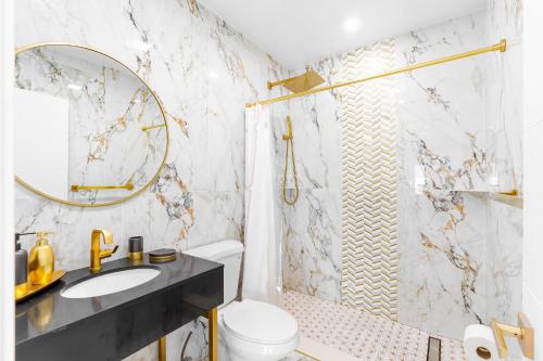 a bathroom with a toilet and a sink and a shower at 316 Footloose #3 in Hollywood