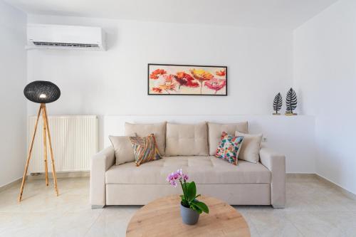 a living room with a couch and a table at K&D Central Suite in Sitia