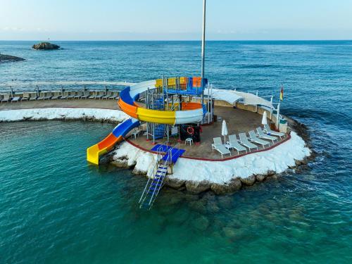 a water slide in the middle of the ocean at Orange County Alanya in Okurcalar