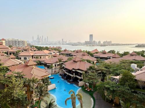 an aerial view of a resort with a swimming pool at Lux BnB I Palm Jumeirah Resort I Palm Views in Dubai