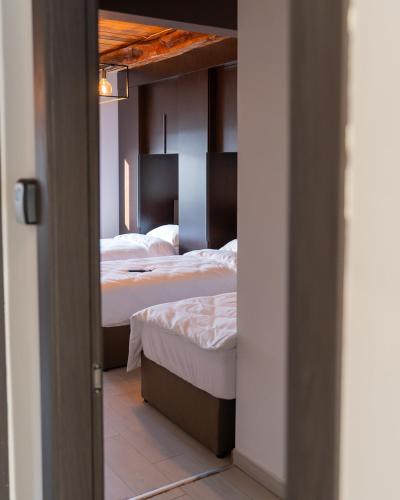 Katil atau katil-katil dalam bilik di Arena Rooms Zagreb