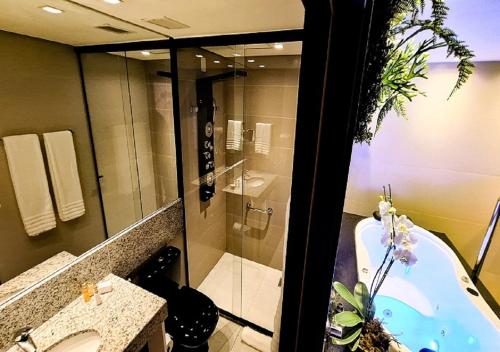 Um banheiro em eSuites Virgínia Luxemburgo